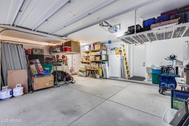 19414 W Pasadena Ave, Litchfield Park, AZ 85340 - garage featuring a garage door opener and fridge