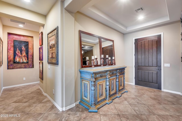 19414 W Pasadena Ave, Litchfield Park, AZ 85340 - entryway with light tile patterned floors, a tray ceiling, baseboards, and recessed lighting