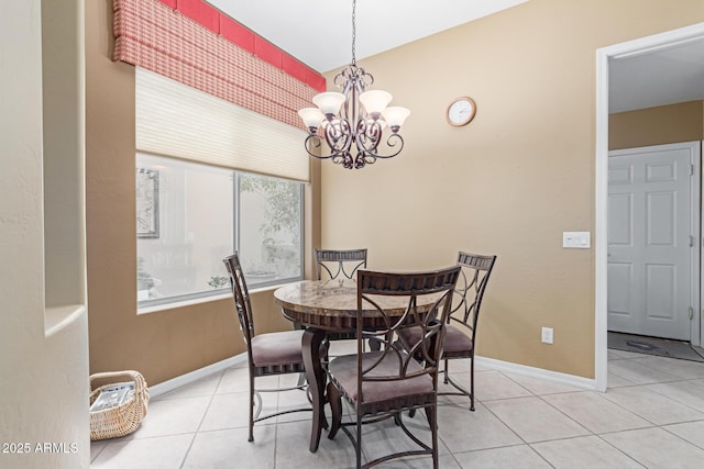 dining room featuring light tile patterned floors, baseboards, and a chandelier