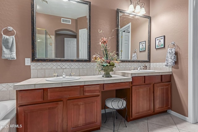 bathroom with double vanity, tasteful backsplash, and a sink