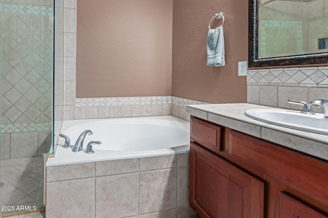 bathroom featuring a shower stall, backsplash, a bath, and vanity