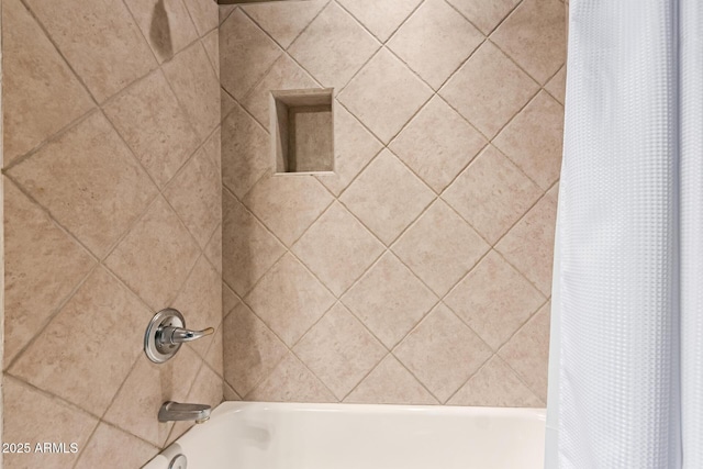 full bath featuring shower / bath combo with shower curtain