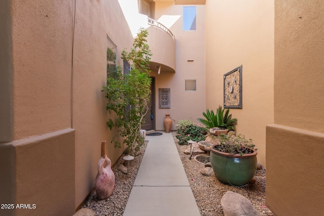 entrance to property with stucco siding