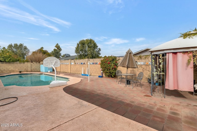 view of pool featuring a patio and a water slide