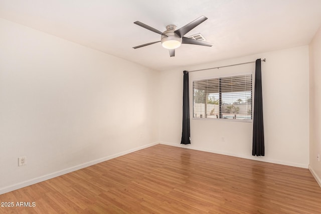 empty room featuring light wood-type flooring and ceiling fan