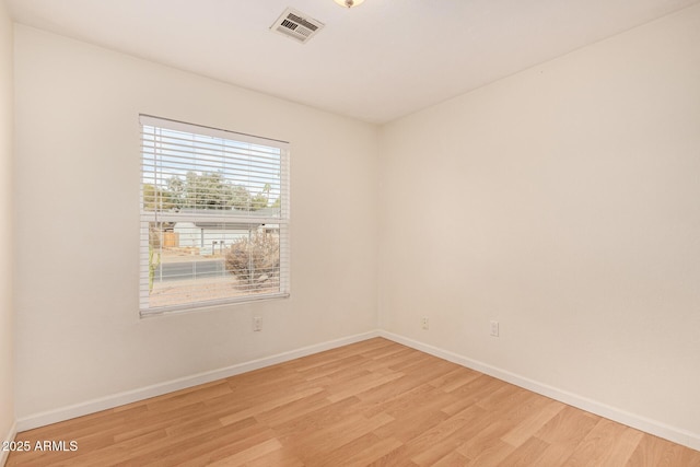 empty room with light wood-type flooring