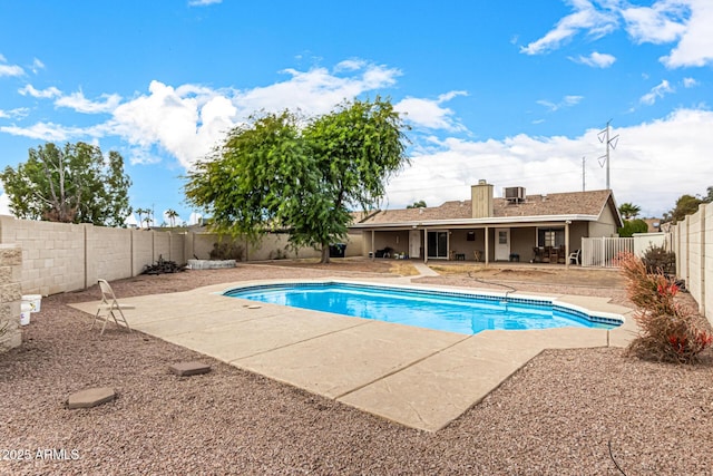 view of swimming pool with central AC unit and a patio area