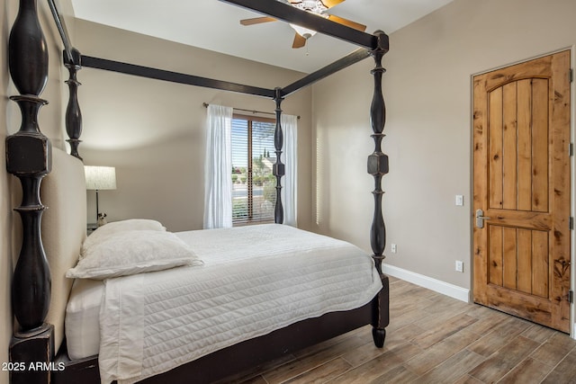 6861 W Calle Lejos, Peoria, AZ 85383 - bedroom with wood finished floors and a ceiling fan