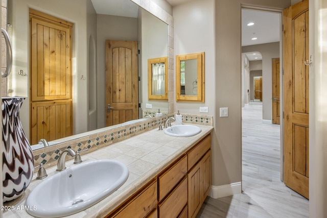 6861 W Calle Lejos, Peoria, AZ 85383 - bathroom with double vanity, recessed lighting, and wood finished floors