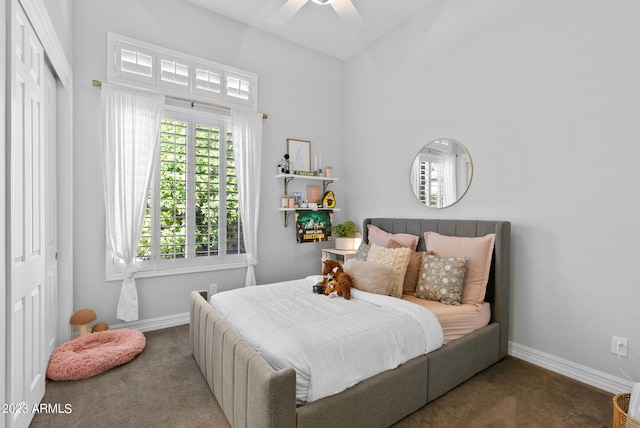 carpeted bedroom featuring a closet and ceiling fan