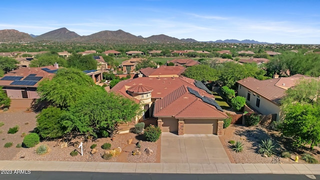 birds eye view of property featuring a mountain view