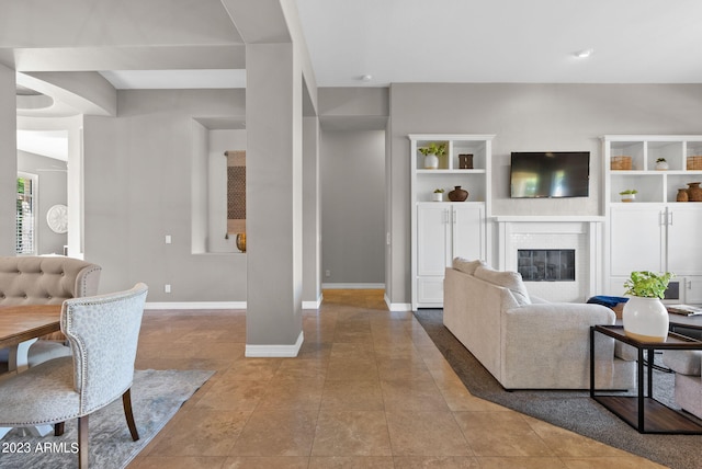 tiled living room with a fireplace