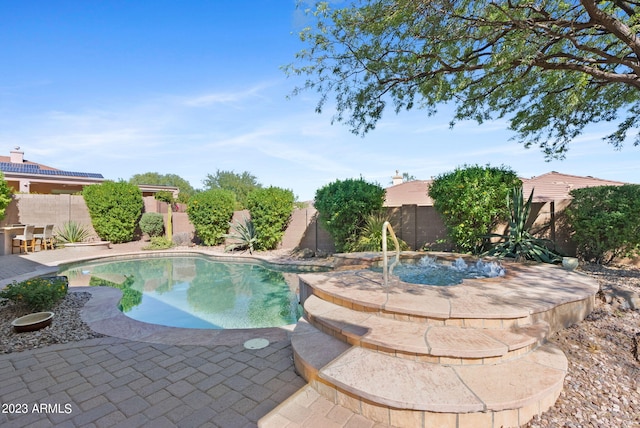 view of swimming pool with a patio area