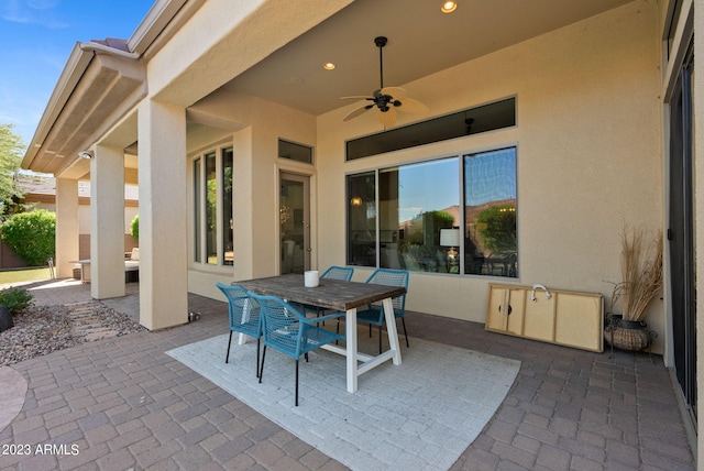 view of patio featuring ceiling fan