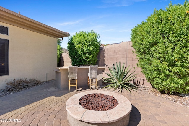 view of patio / terrace featuring a fire pit