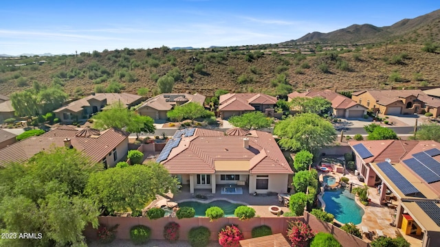 drone / aerial view featuring a mountain view