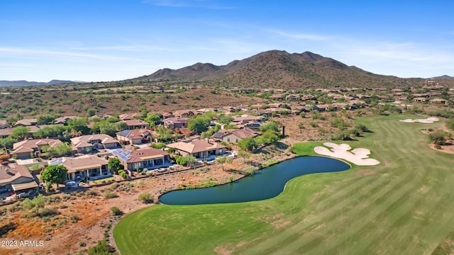 drone / aerial view featuring a water and mountain view