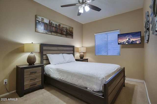 carpeted bedroom featuring baseboards and ceiling fan