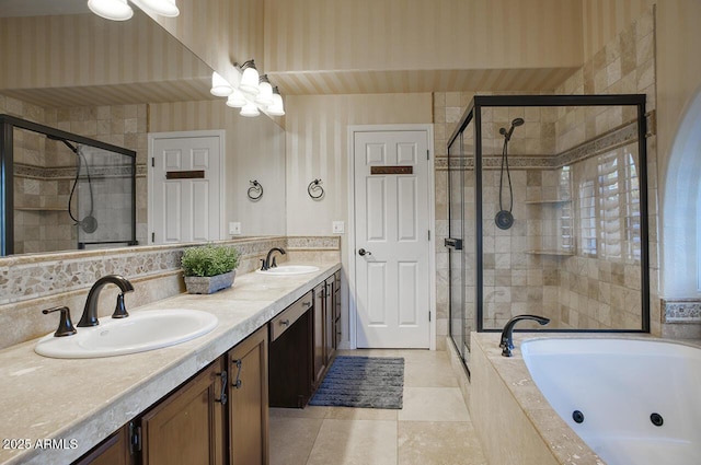 bathroom with a shower stall, a tub with jets, tile patterned flooring, and a sink