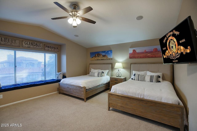 carpeted bedroom with a ceiling fan, baseboards, and lofted ceiling