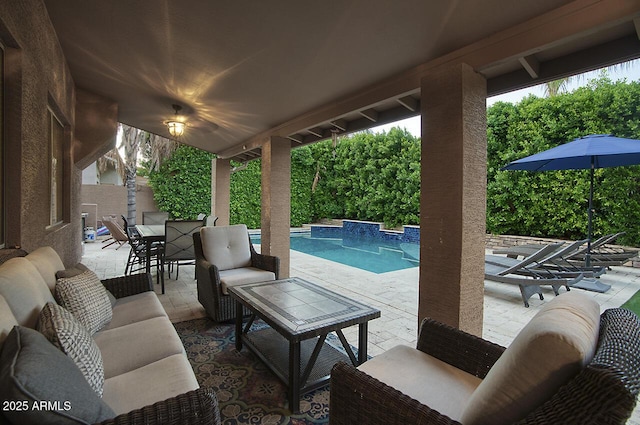 view of patio with an outdoor hangout area, an outdoor pool, and fence