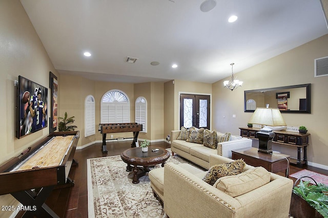 living area with dark wood-style flooring, recessed lighting, french doors, and visible vents