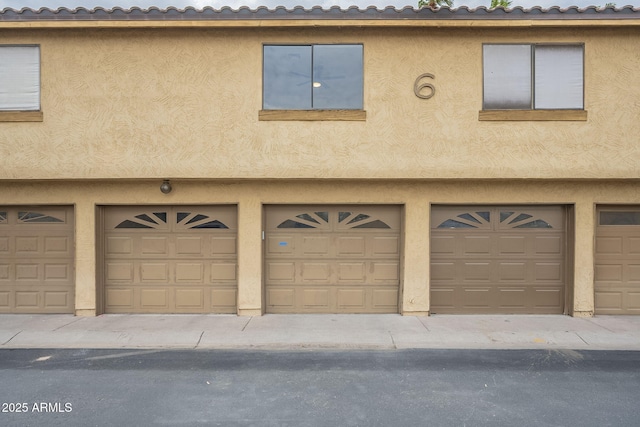 view of front of property featuring stucco siding and an attached garage