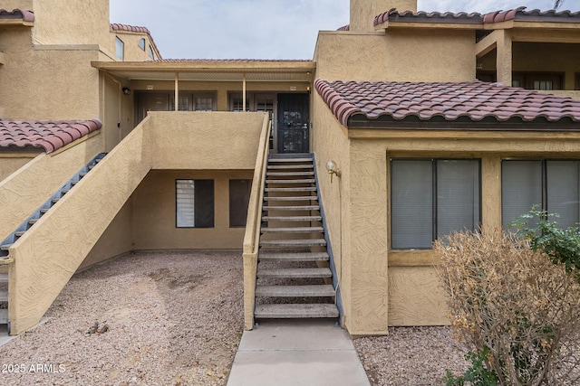 view of property featuring stairs