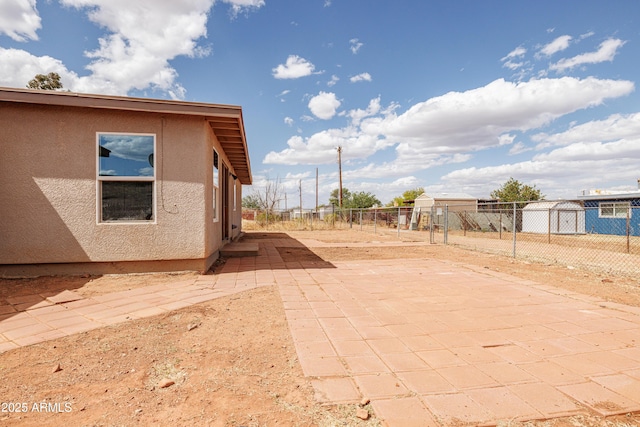 view of patio featuring fence