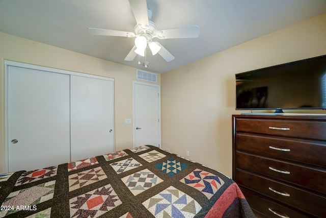 bedroom featuring ceiling fan and a closet