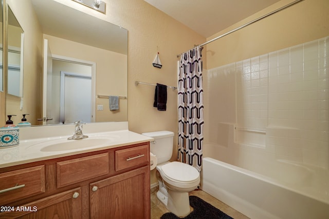 full bathroom featuring tile patterned flooring, shower / bath combo, vanity, and toilet