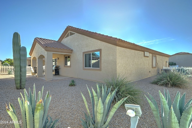 rear view of property with a patio area