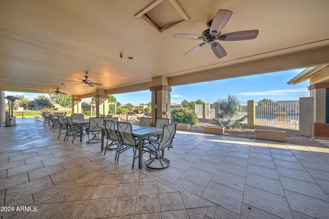 view of patio featuring ceiling fan