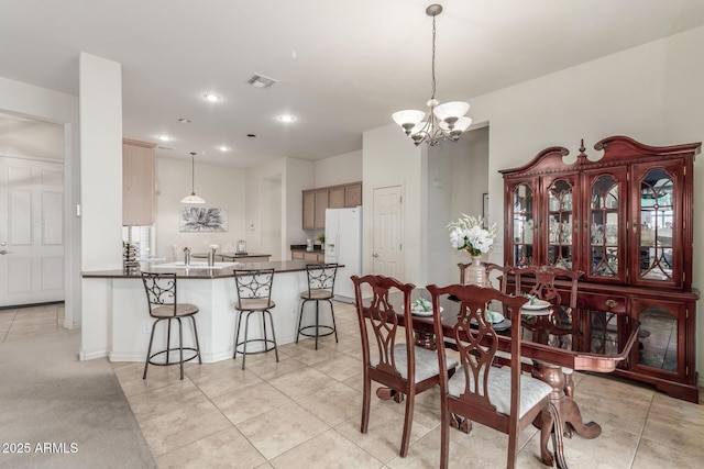 dining space with an inviting chandelier, recessed lighting, visible vents, and light tile patterned floors