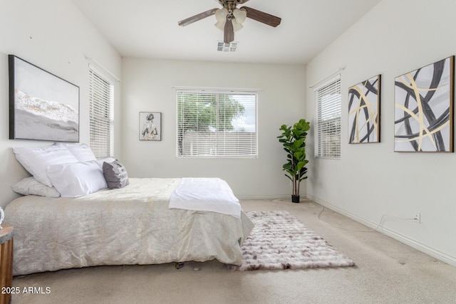 bedroom with visible vents, baseboards, a ceiling fan, and carpet flooring