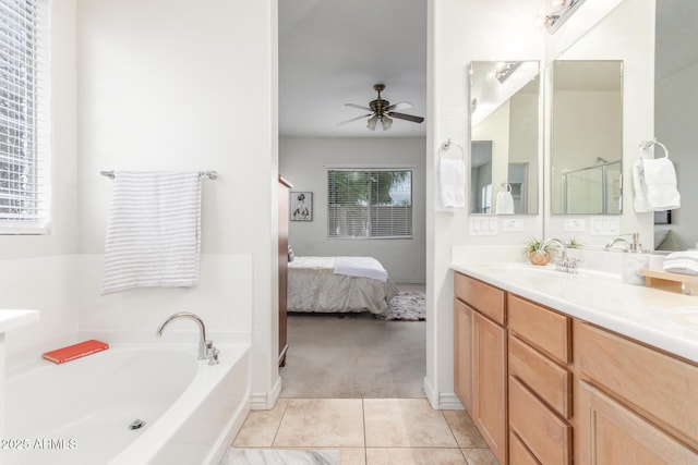 bathroom with vanity, tile patterned flooring, ensuite bathroom, a bath, and ceiling fan