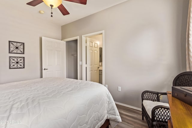 bedroom with ceiling fan, wood finished floors, ensuite bathroom, and baseboards