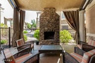 view of patio featuring a fireplace