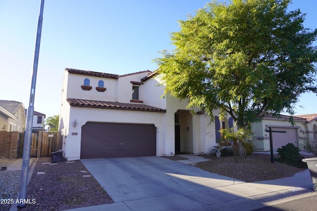 mediterranean / spanish-style home featuring a garage