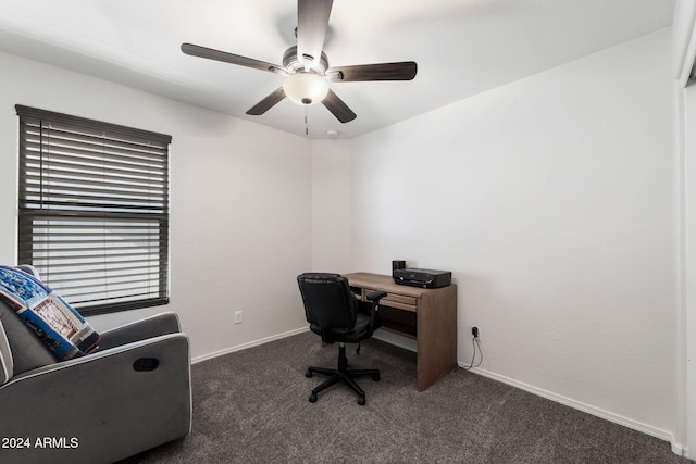 office featuring ceiling fan and dark carpet