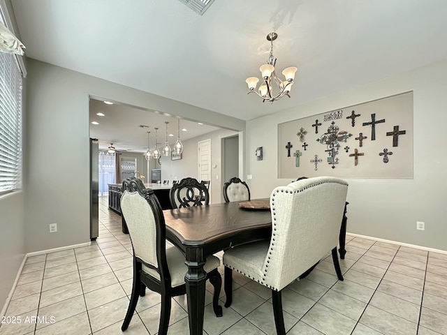 dining space with visible vents, baseboards, light tile patterned flooring, recessed lighting, and ceiling fan with notable chandelier