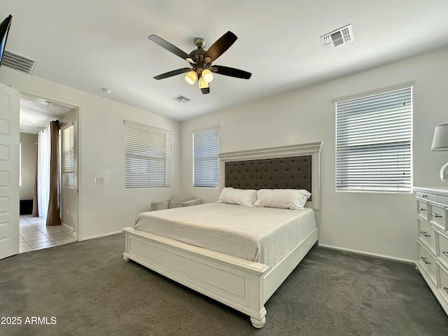 bedroom featuring visible vents, carpet floors, and ceiling fan