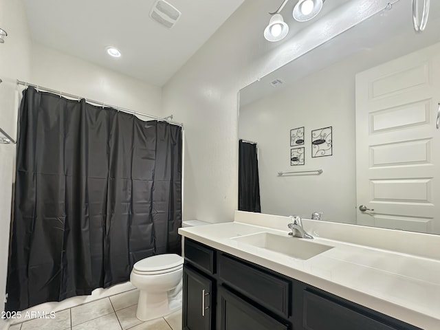 full bathroom featuring vanity, a shower with shower curtain, visible vents, tile patterned floors, and toilet