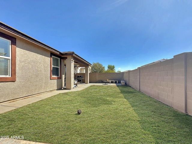 view of yard featuring a patio and a fenced backyard