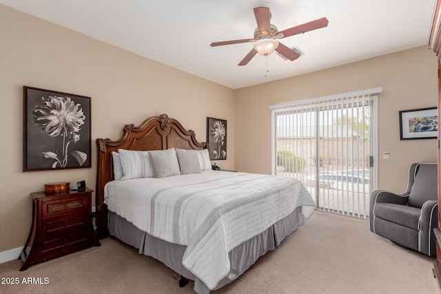 bedroom featuring light colored carpet, ceiling fan, and access to outside