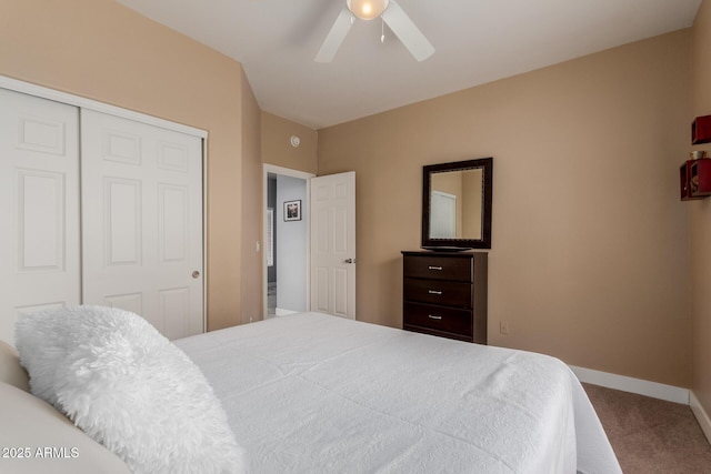 carpeted bedroom with baseboards, a closet, and ceiling fan