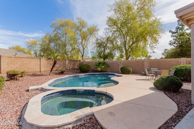 view of swimming pool with a fenced in pool, a patio, an in ground hot tub, and a fenced backyard