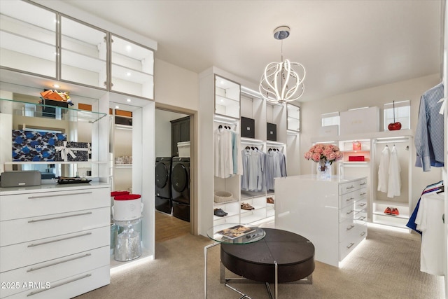 15711 S 11th Ave, Phoenix, AZ 85045 - walk in closet with separate washer and dryer, a chandelier, and light colored carpet