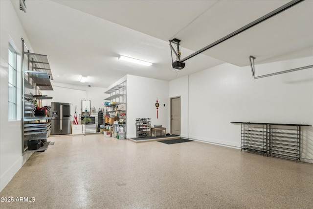 15711 S 11th Ave, Phoenix, AZ 85045 - garage featuring stainless steel fridge with ice dispenser and a garage door opener