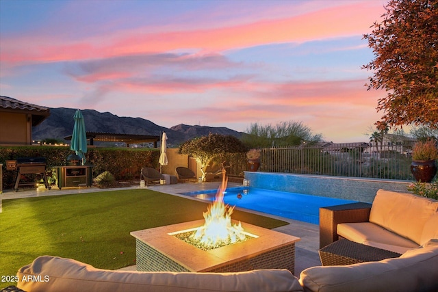 15711 S 11th Ave, Phoenix, AZ 85045 - view of pool featuring an outdoor living space with a fire pit, a mountain view, and a patio